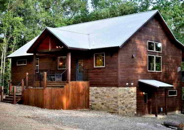 250 Almond Ln, Broken Bow, OK 74728 - rustic home featuring stone siding and a porch