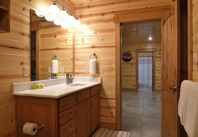 250 Almond Ln, Broken Bow, OK 74728 - bathroom featuring wood walls, vanity, and tile patterned floors