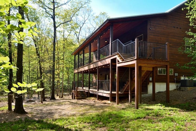 250 Almond Ln, Broken Bow, OK 74728 - view of property exterior featuring a wooden deck and stairs