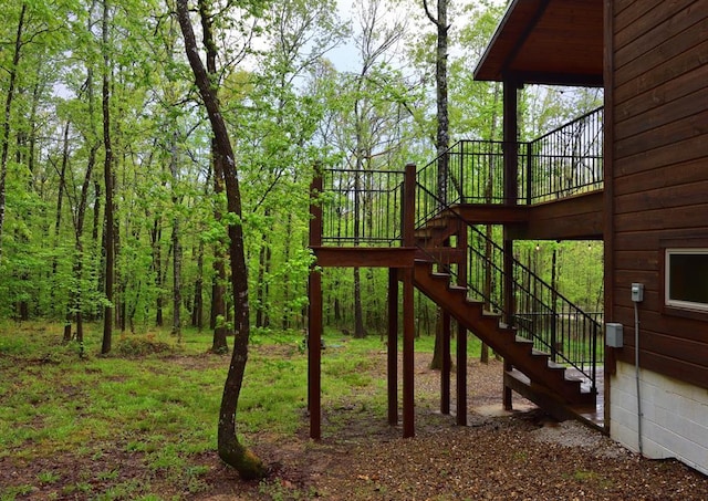 250 Almond Ln, Broken Bow, OK 74728 - view of play area featuring stairway and a wooden deck