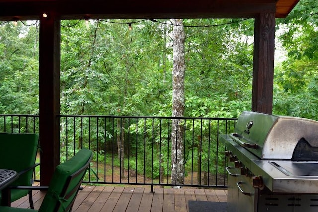 250 Almond Ln, Broken Bow, OK 74728 - deck featuring a forest view and a grill
