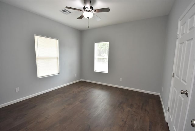 411 W Highland St, Shawnee, OK 74801 - spare room featuring a ceiling fan, baseboards, and dark wood-style floors