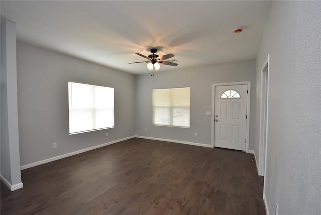 411 W Highland St, Shawnee, OK 74801 - foyer entrance featuring a ceiling fan and dark wood-style flooring