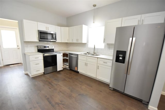411 W Highland St, Shawnee, OK 74801 - kitchen featuring appliances with stainless steel finishes, light countertops, backsplash, and white cabinets