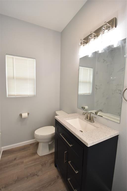 411 W Highland St, Shawnee, OK 74801 - bathroom with vanity, wood finished floors, and a marble finish shower