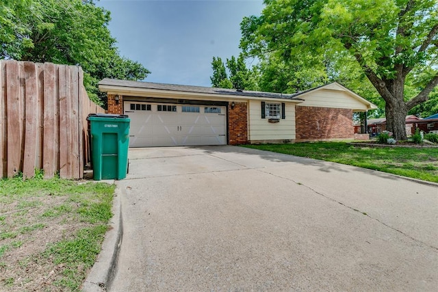601 Woodland Way, Oklahoma City, OK 73127 - view of front facade featuring brick siding, a garage, and concrete driveway