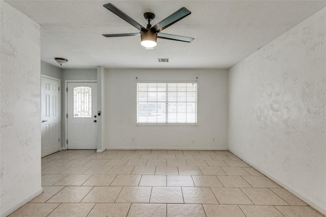 601 Woodland Way, Oklahoma City, OK 73127 - entryway with a ceiling fan and light tile patterned floors