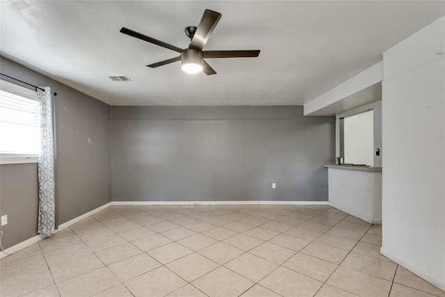 601 Woodland Way, Oklahoma City, OK 73127 - empty room featuring ceiling fan and light tile patterned flooring