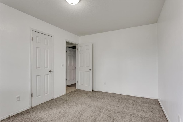 601 Woodland Way, Oklahoma City, OK 73127 - unfurnished bedroom featuring carpet