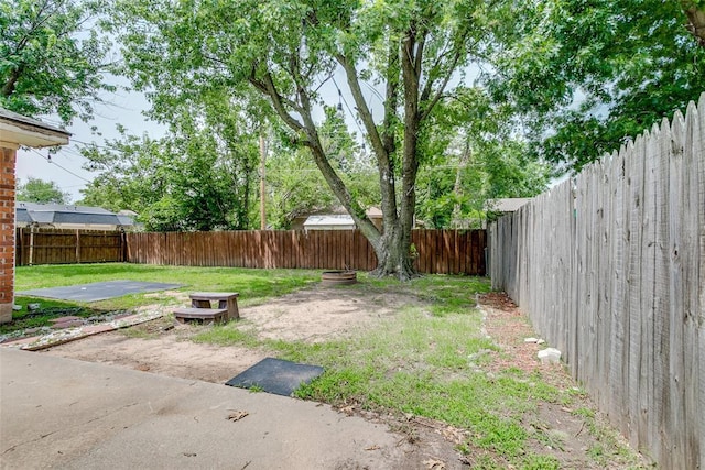 601 Woodland Way, Oklahoma City, OK 73127 - fenced backyard featuring a patio area