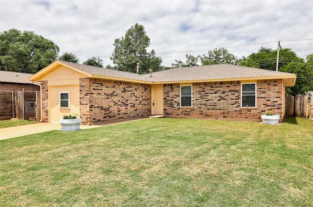 1633 SE 52nd St, Oklahoma City, OK 73129 - ranch-style house featuring brick siding, roof with shingles, and driveway