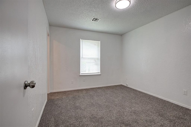 1633 SE 52nd St, Oklahoma City, OK 73129 - spare room with a textured ceiling, carpet, and baseboards