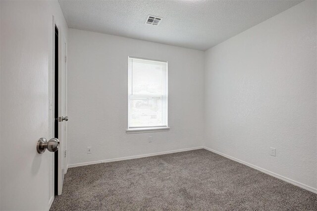 1633 SE 52nd St, Oklahoma City, OK 73129 - spare room with carpet, a textured ceiling, and baseboards