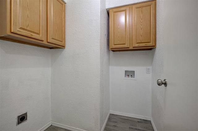 1633 SE 52nd St, Oklahoma City, OK 73129 - laundry room with hookup for an electric dryer, cabinet space, hookup for a washing machine, baseboards, and dark wood-type flooring