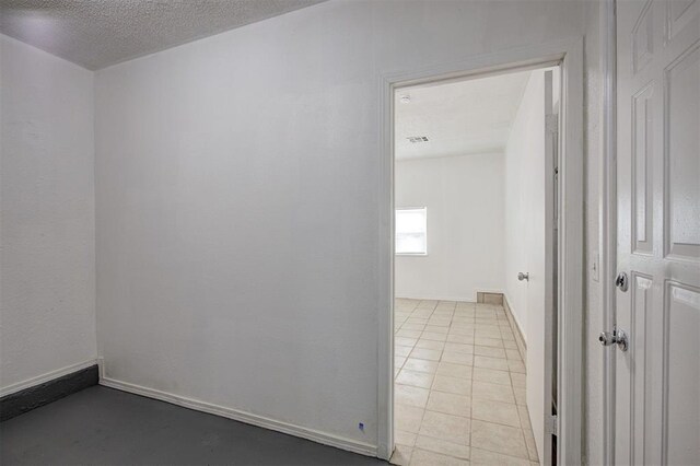 1633 SE 52nd St, Oklahoma City, OK 73129 - spare room with a textured ceiling and baseboards