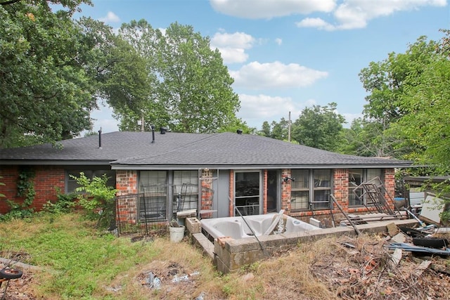 1001 N Pine St, Midwest City, OK 73130 - rear view of property featuring brick siding and a shingled roof