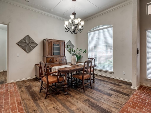 2500 Huntwick Dr, Edmond, OK 73034 - dining area with ornamental molding, a chandelier, baseboards, and brick flooring