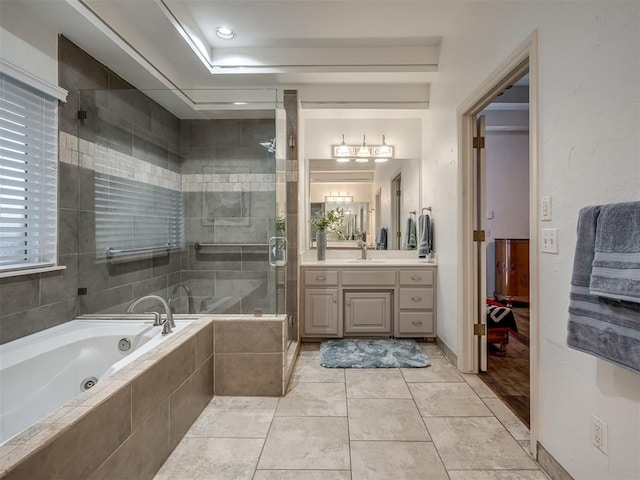2500 Huntwick Dr, Edmond, OK 73034 - full bathroom with vanity, a whirlpool tub, a shower stall, and tile patterned floors