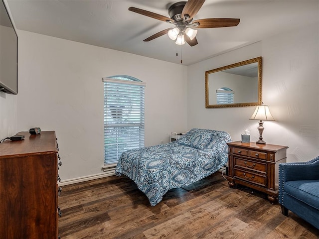 2500 Huntwick Dr, Edmond, OK 73034 - bedroom with wood finished floors, baseboards, and a ceiling fan