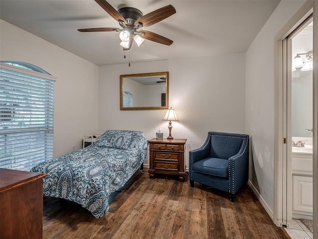 2500 Huntwick Dr, Edmond, OK 73034 - bedroom with wood finished floors and a ceiling fan