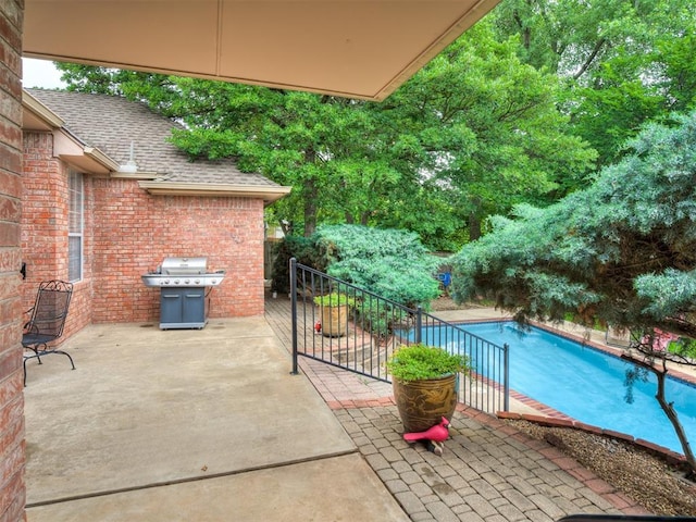 2500 Huntwick Dr, Edmond, OK 73034 - view of swimming pool featuring a patio area and grilling area