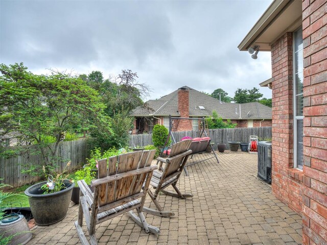 2500 Huntwick Dr, Edmond, OK 73034 - fenced backyard with a patio area