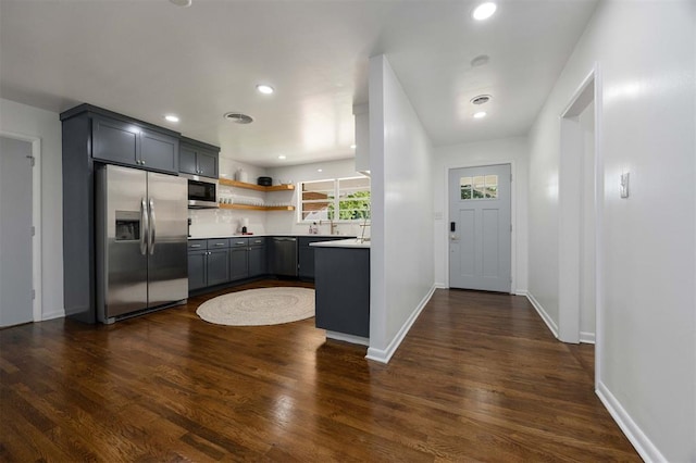 1224 W Brooks St, Norman, OK 73069 - kitchen with appliances with stainless steel finishes, dark wood-style flooring, open shelves, baseboards, and recessed lighting