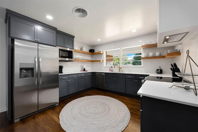 1224 W Brooks St, Norman, OK 73069 - kitchen featuring appliances with stainless steel finishes, open shelves, tasteful backsplash, a sink, and recessed lighting