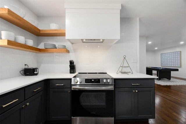1224 W Brooks St, Norman, OK 73069 - kitchen featuring stainless steel electric range oven, dark wood-style floors, open shelves, tasteful backsplash, and light countertops