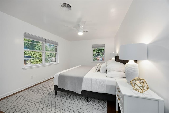 1224 W Brooks St, Norman, OK 73069 - bedroom featuring baseboards, a ceiling fan, and wood finished floors