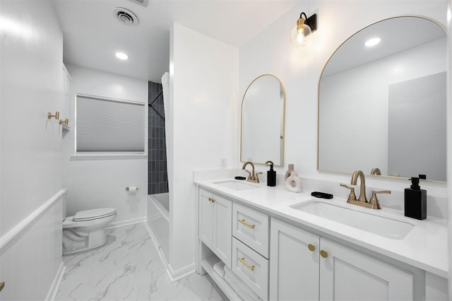 1224 W Brooks St, Norman, OK 73069 - bathroom featuring double vanity, toilet, shower / bathtub combination, marble look tile flooring, and recessed lighting