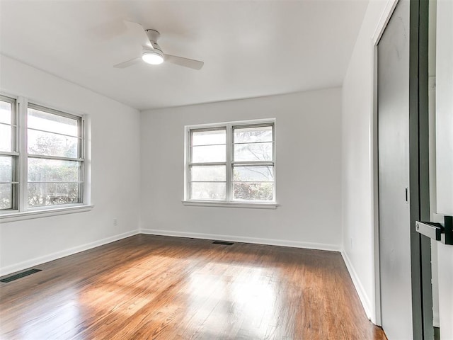 1224 W Brooks St, Norman, OK 73069 - spare room featuring a ceiling fan, wood finished floors, and baseboards