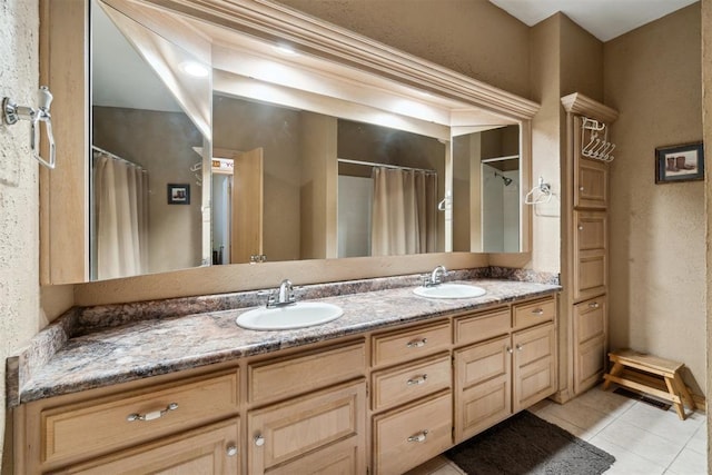 11700 Hackney Ln, Yukon, OK 73099 - bathroom featuring double vanity, tile patterned flooring, a shower with curtain, and a textured wall
