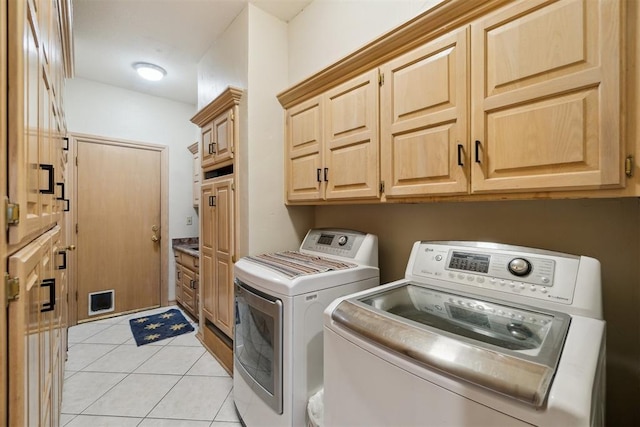 11700 Hackney Ln, Yukon, OK 73099 - laundry room featuring independent washer and dryer, cabinet space, and light tile patterned flooring