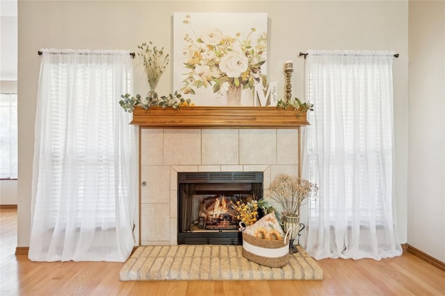 1908 Riviera Dr, Tuttle, OK 73089 - detailed view of wood finished floors, a fireplace, and baseboards