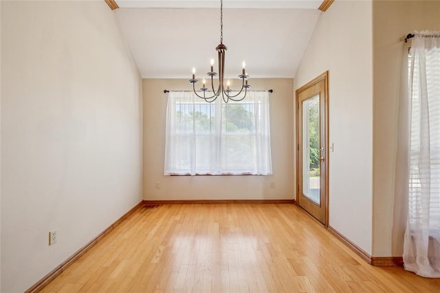 1908 Riviera Dr, Tuttle, OK 73089 - unfurnished dining area featuring a chandelier, light wood-style flooring, baseboards, and lofted ceiling