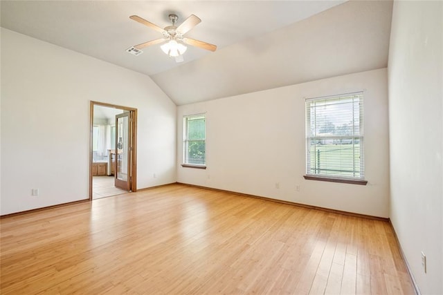 1908 Riviera Dr, Tuttle, OK 73089 - spare room with light wood-style floors, vaulted ceiling, ceiling fan, and baseboards
