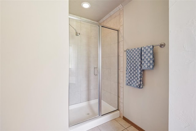 1908 Riviera Dr, Tuttle, OK 73089 - full bath featuring tile patterned floors, a stall shower, and baseboards