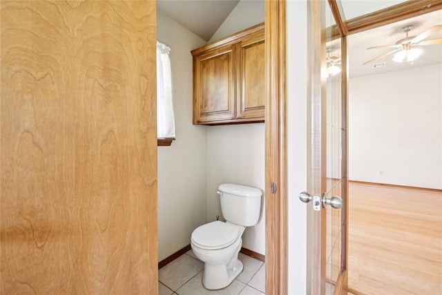 1908 Riviera Dr, Tuttle, OK 73089 - bathroom featuring toilet, lofted ceiling, a ceiling fan, tile patterned flooring, and baseboards