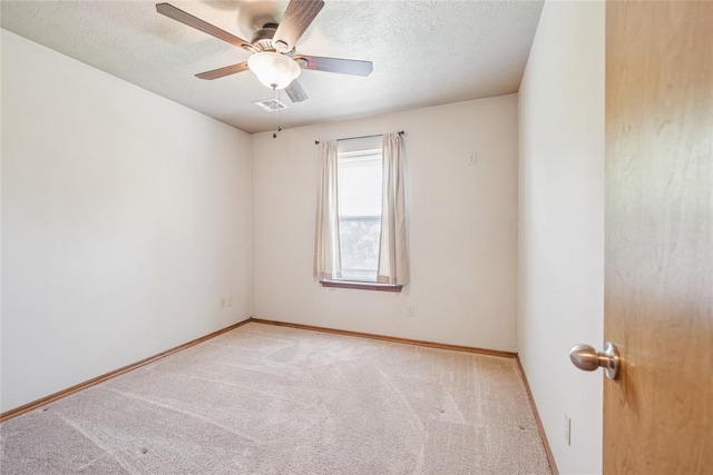 1908 Riviera Dr, Tuttle, OK 73089 - unfurnished room with carpet, ceiling fan, baseboards, and a textured ceiling