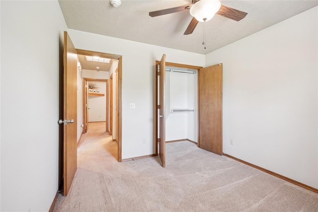 1908 Riviera Dr, Tuttle, OK 73089 - unfurnished bedroom featuring light carpet, baseboards, and ceiling fan