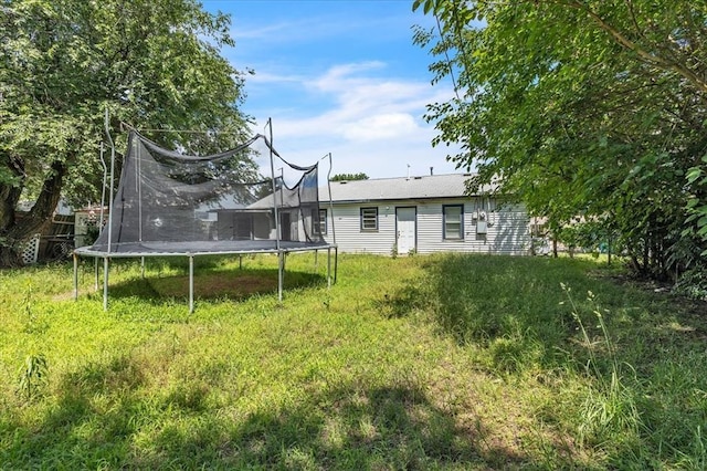 2119 Pearson Dr, Midwest City, OK 73110 - view of yard featuring a trampoline