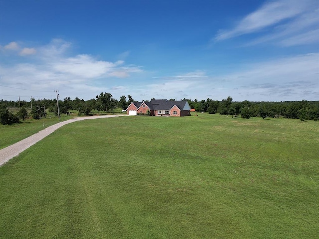 26603 Main St, Blanchard, OK 73010 - view of grassy yard featuring driveway