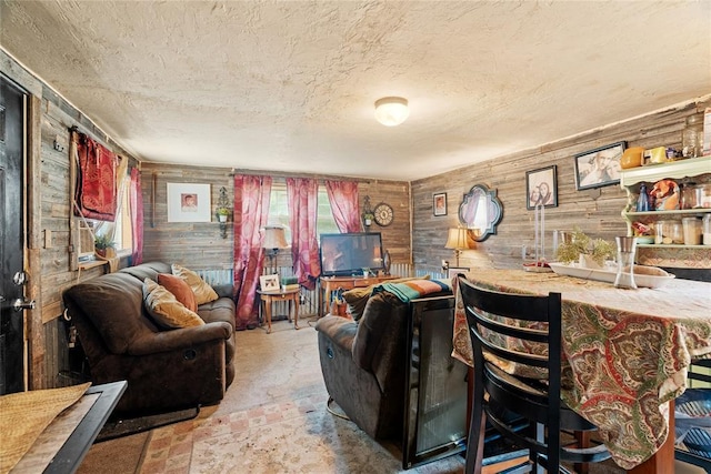 21380 E Fifth St, Hinton, OK 73047 - living room featuring a textured ceiling, wood walls, and bar