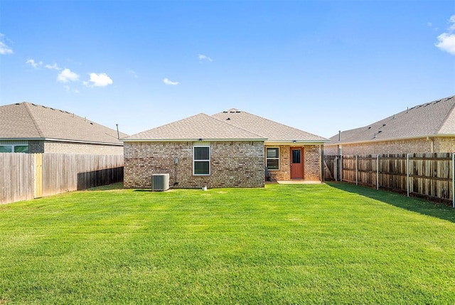 11604 NW 95th St, Yukon, OK 73099 - back of house featuring brick siding and a fenced backyard