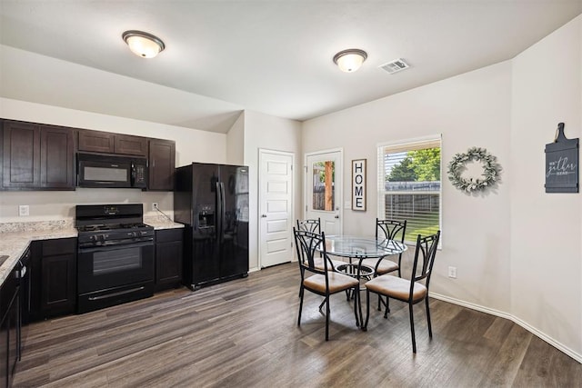 11604 NW 95th St, Yukon, OK 73099 - dining room with dark wood-type flooring and baseboards