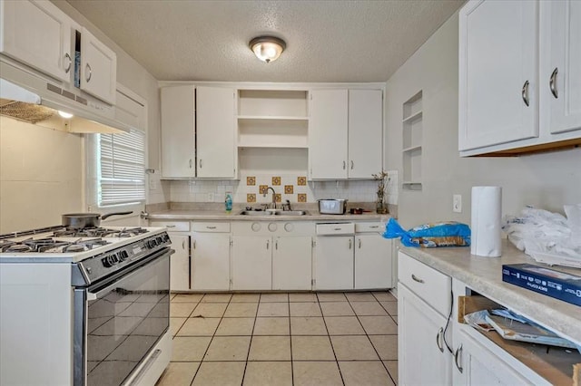 1500 Maple Dr, Midwest City, OK 73110 - kitchen featuring white appliances, open shelves, under cabinet range hood, a textured ceiling, and tasteful backsplash