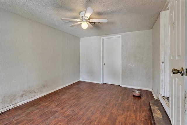 1500 Maple Dr, Midwest City, OK 73110 - unfurnished bedroom featuring wood finished floors, a textured ceiling, and ceiling fan