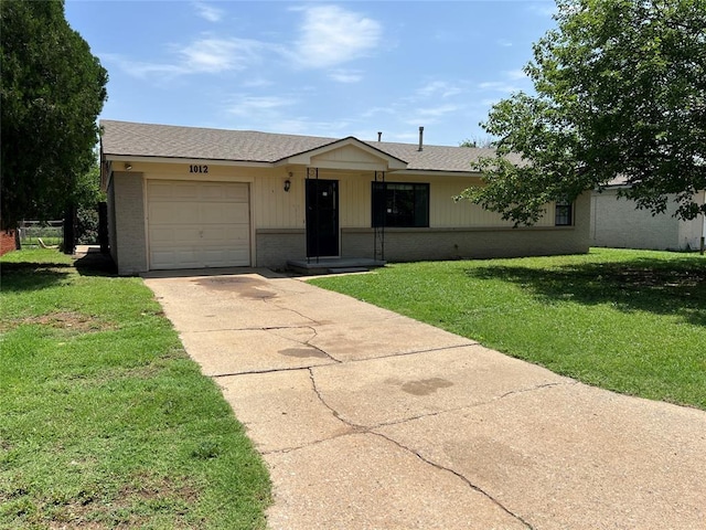 1012 Box St, Altus, OK 73521 - ranch-style home with driveway, brick siding, an attached garage, and a front yard