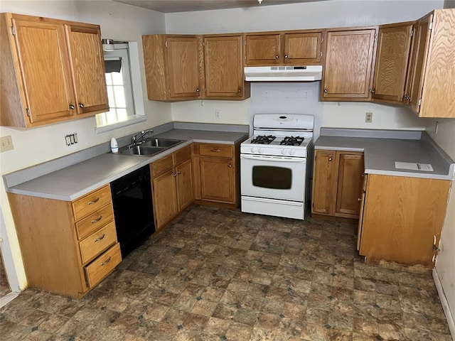 1012 Box St, Altus, OK 73521 - kitchen with white gas range, dishwasher, under cabinet range hood, a sink, and brown cabinetry
